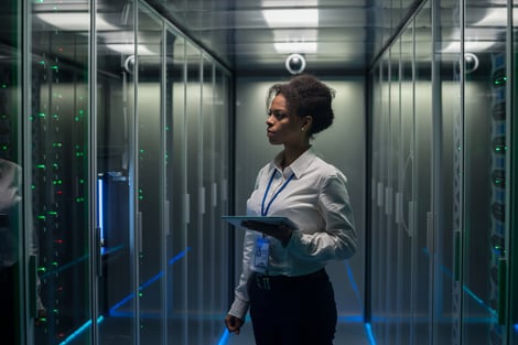 Woman in Data Center Server Room