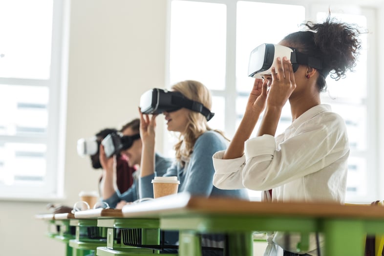 Students using Virtual Reality devices in a classroom environment