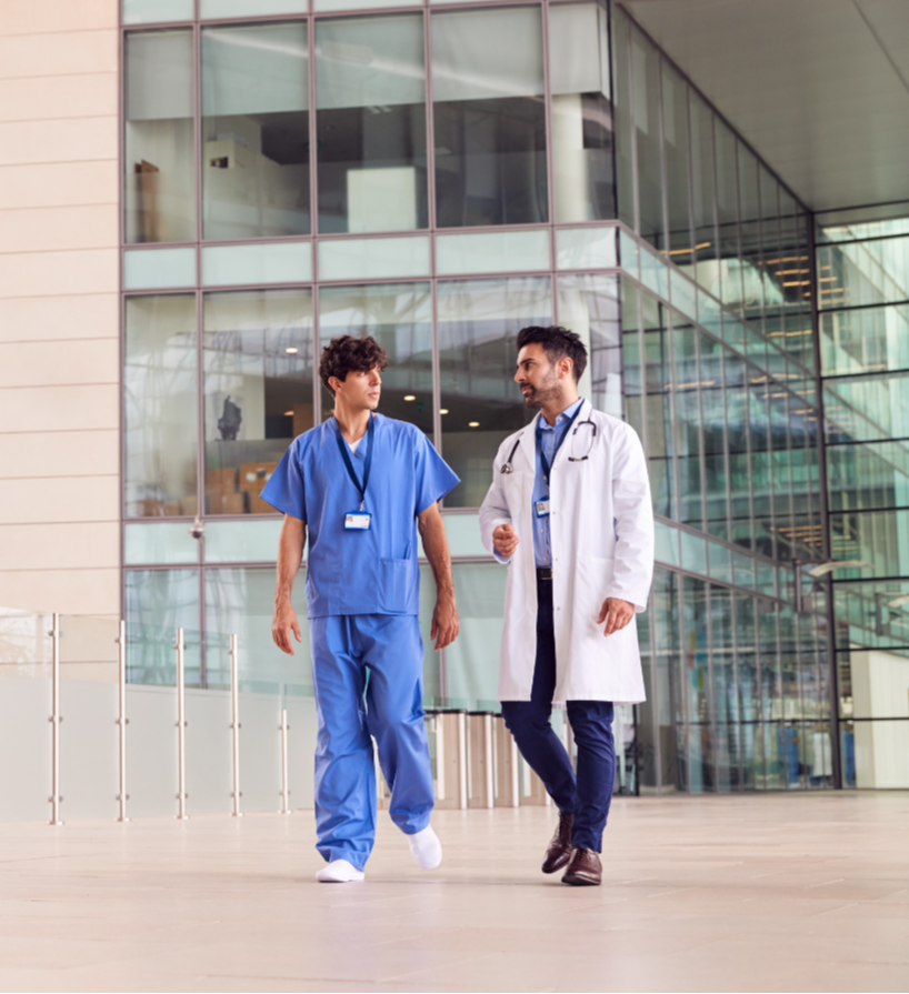 Header 2 Image_Doctor and Nurse Walking in Healthcare Facility-1